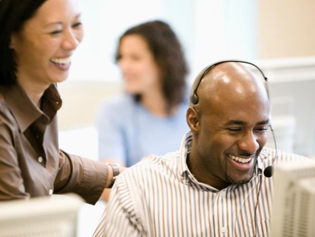 Call center employees helping customers.